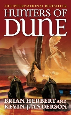 Mass market paperback of Hunters of Dune by Tor Books, showing the book cover with title and author details.