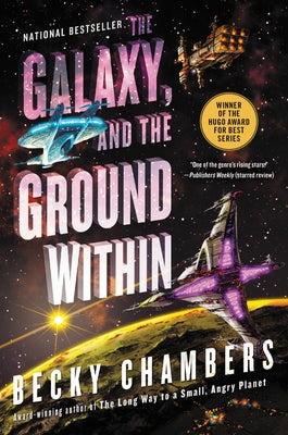 Paperback of "The Galaxy, and the Ground Within" by Harper Voyager, showing the book cover with space-themed artwork.