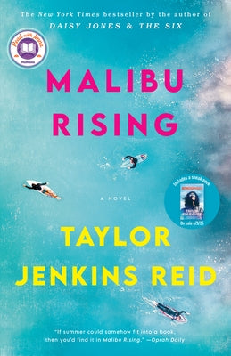 Paperback copy of Malibu Rising by Ballantine Books, featuring the book cover with vibrant artwork and title text.