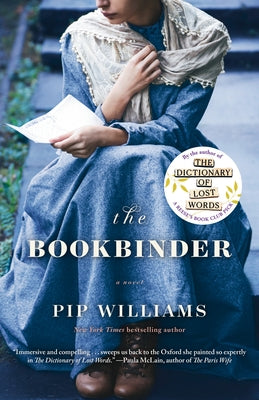 Paperback copy of The Bookbinder novel by Ballantine Books, featuring a cover with intricate bookbinding artwork.