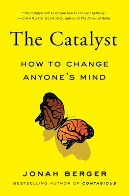 Paperback of "The Catalyst" by Simon & Schuster showing the book cover with title and author’s name in bold text.