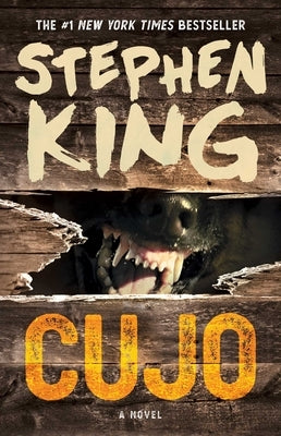Paperback copy of Cujo by Scribner Book Company, featuring the book cover with a descriptive illustration.