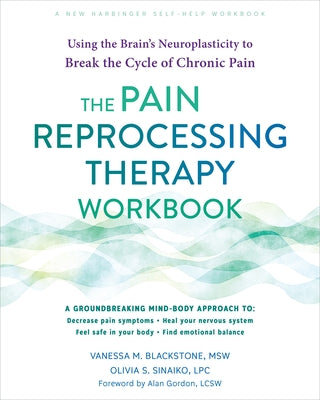 Open paperback of The Pain Reprocessing Therapy Workbook by New Harbinger Publications, showing colorful interior pages.