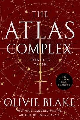 Paperback of The Atlas Complex novel by Tor Books, showing the book cover with abstract artwork and title text.