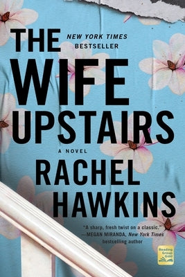 Paperback copy of The Wife Upstairs novel by St. Martin's Griffin, featuring a cover with an intriguing design and title text.