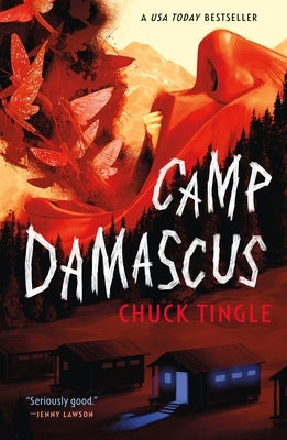 Paperback copy of "Camp Damascus" by Tor Nightfire featuring cover art with a mysterious, dark landscape scene.