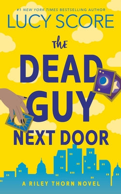Paperback copy of The Dead Guy Next Door: A Riley Thorn Novel by Bloom Books, featuring a book cover with dark and mysterious artwork.