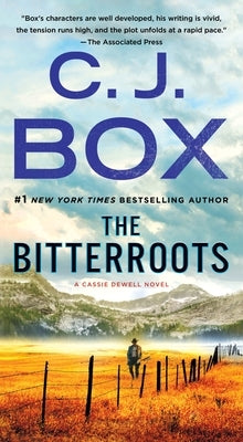 Mass market paperback of The Bitterroots by Minotaur Books, featuring the book cover with title and author details.