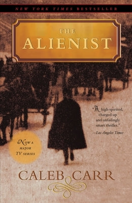 Paperback of The Alienist novel by Random House Trade, featuring a dark cover design with eerie imagery.