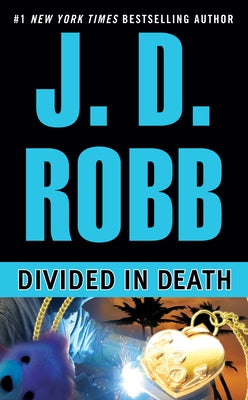 Mass market paperback of "Divided in Death" by Berkley Books, featuring the book cover with title and author details.