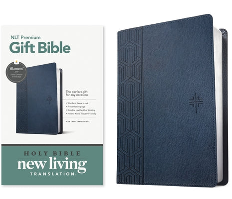 Blue leatherlike Tyndale House Bible with red letter text, blue cross, and filament-enabled features, designed for premium gift presentation.