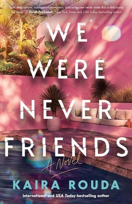 Paperback copy of "We Were Never Friends" novel by Poisoned Pen Press, showing the book cover with title and author details.