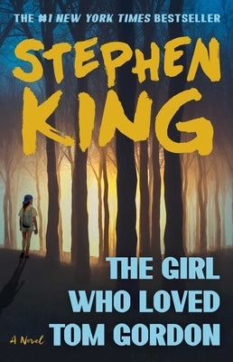 Paperback copy of "The Girl Who Loved Tom Gordon" by Scribner Book Company, showing the front cover with title and author details.