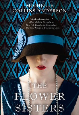 Paperback copy of The Flower Sisters novel by John Scognamiglio Book featuring colorful floral cover art.