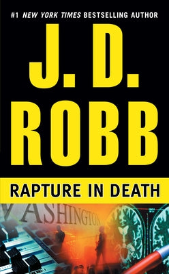 Cover of the mass market paperbound novel "Rapture in Death" by Berkley Books featuring a dark, dramatic design.