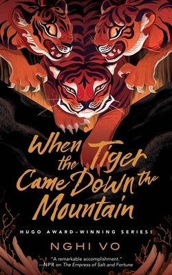 Paperback of "When the Tiger Came Down the Mountain" by Tordotcom featuring a colorful cover with a tiger illustration.