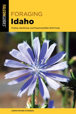 Paperback foraging book titled "Foraging Idaho" by Falcon Press Publishing, featuring colorful illustrations of edible plants and foraging tips.