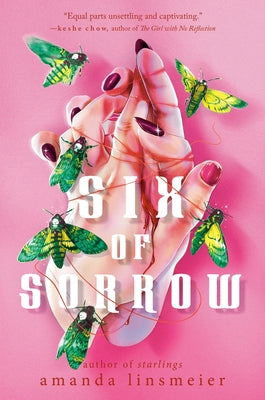 Paperback copy of "Six of Sorrow" by Delacorte Press, showing the book cover with title and author details.