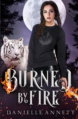 Burned by Fire paperback by Coffee and Characters featuring a dark, fiery cover with intense artwork on the front.