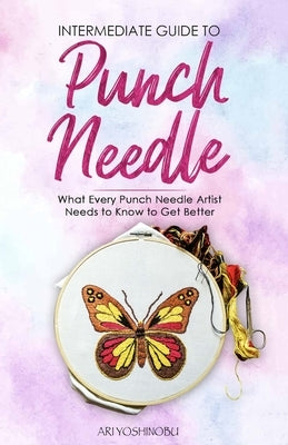 Paperback book titled "Intermediate Guide to Punch Needle" by Craftmills Publishing LLC, featuring a punch needle craft on the cover.