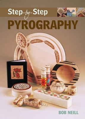 Paperback pyrography book titled "Step-By-Step Pyrography" by GMC Publications with detailed woodworking projects.