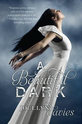 Harperteen paperback book titled "A Beautiful Dark" with a dark cover design, featuring a close-up of the book's front.