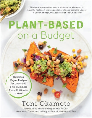 Paperback cookbook titled "Plant-Based on a Budget" by Benbella Books, featuring vegan recipes and meal ideas on a budget.