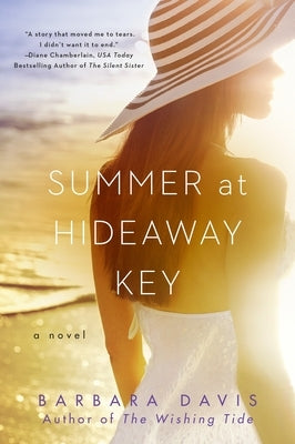 Paperback of "Summer at Hideaway Key" by Berkley/Nal, showing the book cover with colorful summer-themed artwork.