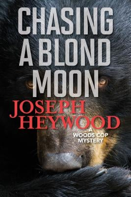 Chasing a Blond Moon: A Woods Cop Mystery Paperback Lyons Press