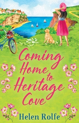 Coming Home to Heritage Cove paperback by Boldwood Books Ltd, showing the book cover with scenic coastal illustration.