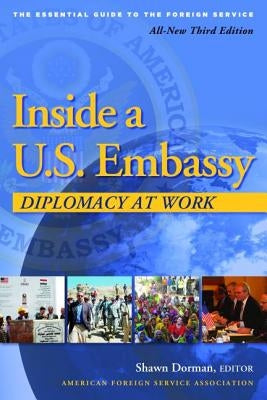 Paperback book titled "Inside a U.S. Embassy" by American Foreign Service Association, featuring a cover with diplomatic imagery.