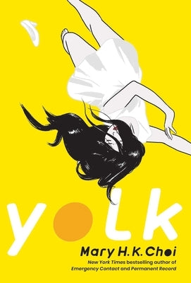 Paperback copy of the book "Yolk" by Simon & Schuster, featuring the cover with colorful design and title text.