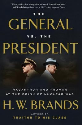 Paperback book titled "The General vs. the President" by Anchor Books, with cover art depicting MacArthur and Truman at the brink of nuclear war.