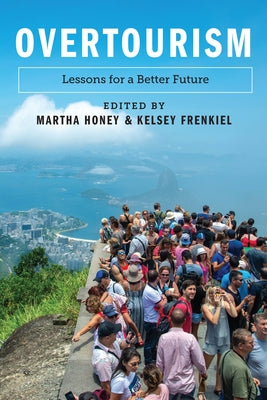 Paperback book titled "Overtourism: Lessons for a Better Future" by Island Press, featuring a cover with a cityscape and travel themes.