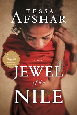 Paperback copy of Jewel of the Nile novel by Tyndale House Publishers, featuring a cover image with warm desert tones.