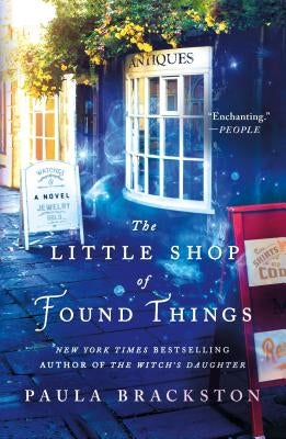 Paperback copy of The Little Shop of Found Things by St. Martin's Griffin featuring a colorful cover with vintage-inspired artwork.
