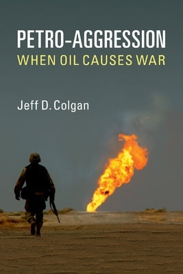 Paperback book titled "Petro-Aggression: When Oil Causes War" by Cambridge University Press, featuring a cover with geopolitical imagery.
