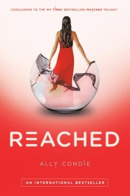Paperback book titled "Reached" by Penguin Books, featuring a cover with vibrant colors and bold typography.