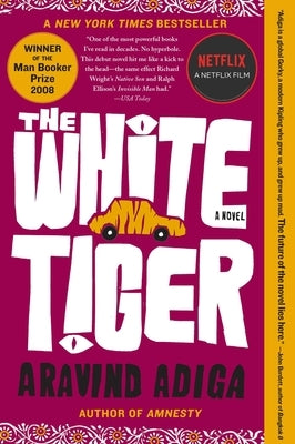 Paperback of "The White Tiger" by Free Press, showing the book cover with title and author details.