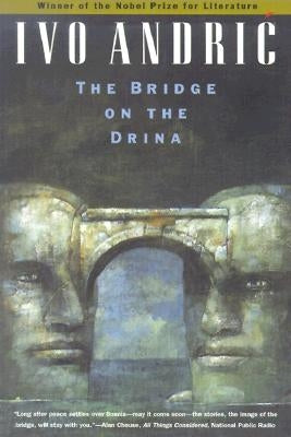 Paperback copy of "The Bridge on the Drina" by University of Chicago Press with a cover image featuring a historic bridge scene.