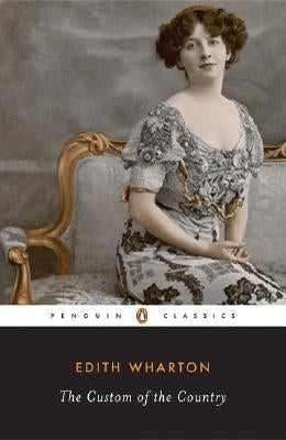 Paperback copy of "The Custom of the Country" by Penguin Group, featuring a classic book cover with vintage-inspired design.