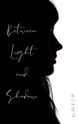 Between Light and Shadow Paperback Libresco Feeds Private Limited