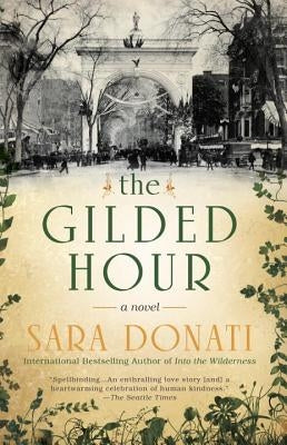 Paperback copy of The Gilded Hour by Berkley Books, featuring the book cover with gold accents and title text.