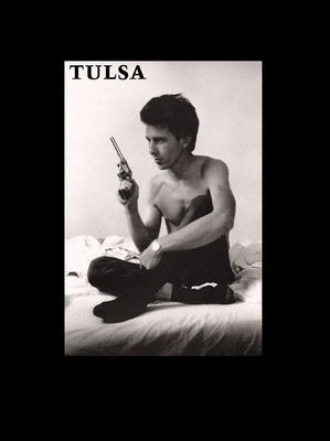 Paperback copy of "Tulsa" by Grove Press, showing the front cover with the title and author details.