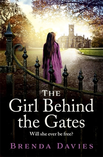 Paperback of The Girl Behind the Gates by Hodder & Stoughton, showing the book cover with title and author details.