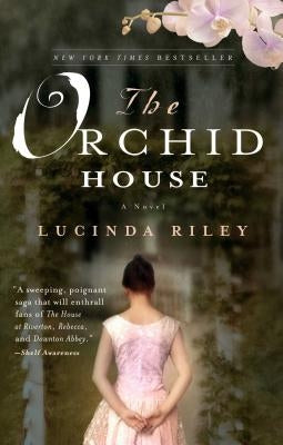 Paperback copy of The Orchid House novel by Atria Books, featuring a floral cover design.