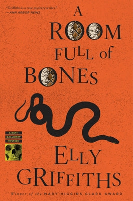 Paperback copy of "A Room Full of Bones" by Mariner Books, showing the book cover with dark, atmospheric artwork.