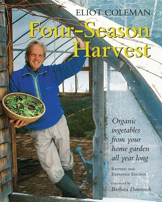 Paperback copy of "Four-Season Harvest" book by Chelsea Green Publishing on organic vegetables for home gardening all year.