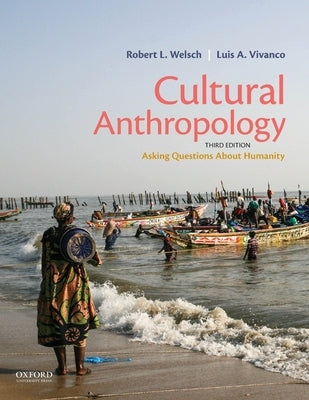 Paperback of Cultural Anthropology book by Oxford University Press showing the cover with cultural symbols and questions about humanity.