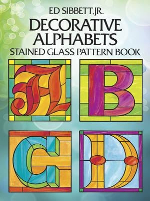 Paperback Decorative Alphabets Stained Glass Pattern Book by Dover Publications featuring colorful alphabet designs and stained glass patterns.